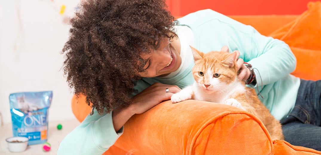 young man with a cat